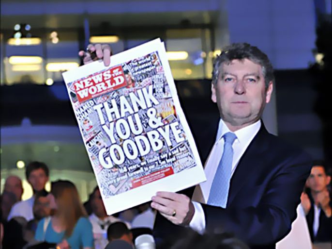 epa : epa02835784 (FILE) A file picture dated 09 July 2011 shows News of the World editor Colin Myler holding the last copy of the paper outside the main building of News International headquarters in London, Britain. Colin Myler and Tom Crone, the News of the World former legal manager,