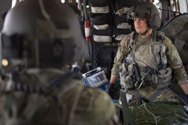 US medic Joshua Nash reacts after stopping treatment on a fatally wounded soldier from the ANA (Afghan National Army) during a Medivac flight, in a helicopter from the 159th Brigade Task Force Thunder, en route to Kandahar Hospital Hero on August 19, 2011.