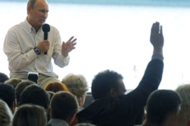 Russian Prime Minister Vladimir Putin (L) answers question at his meeting with participants in the Seliger youth educational forum near Lake Seliger, some 450 kilometres (281 miles) northwest of Moscow, in the Tver region on August 1, 2011.