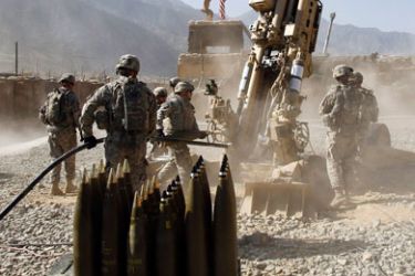 U.S. soldiers from Charlie Battery, 321st Field Artillery Regiment prepare to fire another round of 155MM M777 howitzer at a Taliban enemy position from Forward Operating Base (FOB) Bostic, in Kunar province, eastern Afghanistan September 28, 2011.