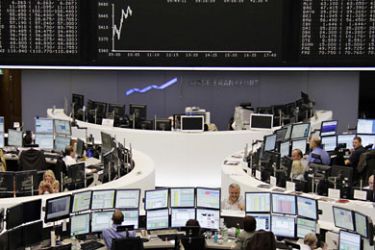 r_Traders are pictured at their desks in front of the DAX board at the Frankfurt stock exchange September 15, 2011. REUTERS/Remote/Bob Strong