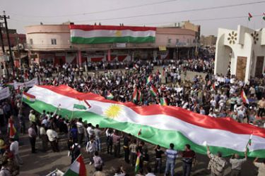 r_Iraqi Kurds wave Kurdish flags during a rally in the disputed Iraqi town