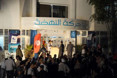 Supporters of Tunisia's Islamist Ennahda party celebrate on October 25, 2011 at the movement headquarters in Tunis.