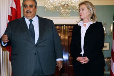 Bahraini Foreign Minister Shaikh Khalid bin Ahmed al-Khalifa (L) and U.S. Secretary of State Hillary Clinton leave make brief remarks to the press in the Treaty Room before bilaterial meetings at the Department of State October 26, 2011 in Washington