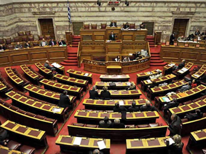Greek MP's argue during a debate in the Greek Parliament on November 2, 2011, at the start of a three-day debate on a vote of confidence. Greek Prime Minister George Papandreou battles for his political life after narrowly securing cabinet backing for a controversial referendum on the country's debt rescue ahead of a confidence vote.