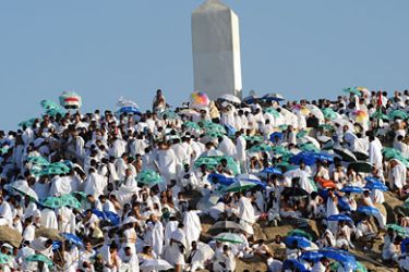 Muslim pilgrims gather at Mount Arafat near the holy city of Mecca, early on November 5, 2011. More than two million Muslims began massing on Saudi Arabia's Mount Arafat and its surrounding plain, marking the peak day of the largest annual pilgrimage. AFP PHOTO/FAYEZ NURELDINE