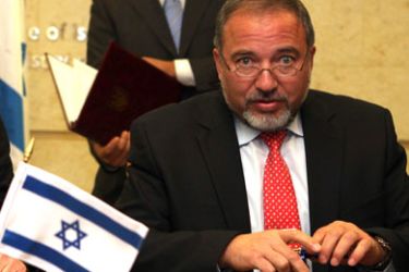 Israeli Foreign Minister Avigdor Lieberman and his Ukrainian counterpart Kostyantyn Gryshchenko (unseen) sign a memorandum on strengthening bilateral cooperation between the two states on November 13, 2011 in Jerusalem.