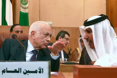 Arab League Secretary General Nabil al-Araby (L) and Qatari Foreign Minister Hamad bin Jassim (C) attend the Arab Foreign Ministers' emergency meeting about Syria, at the Arab League Headquarters in Cairo November 12, 2011.