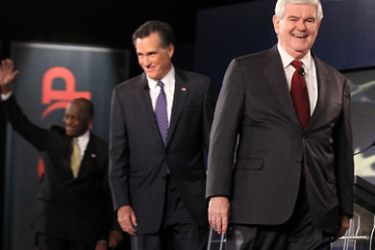 SPARTANBURG, SC - NOVEMBER 12: Republican presidential candidates (L-R) businessman Herman Cain, former Massachusetts Governor Mitt Romney, and former Speaker of the House Newt Gingrich (R-GA) walk on the stage prior to a presidential debate at Wofford College November 12, 2011