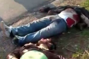An image grab taken from a video uploaded on YouTube on November 22, 2011 shows two of three men reportedly killed when Syrian security forces fired at their car on the road between Sirmin and Idlib in the northwest of the country, near the border with Turkey. Syria's
