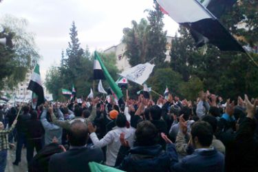 Demonstrators protesting against Syria's President Bashar al-Assad march through the streets in Homs December 6, 2011. Picture taken December 6, 2011.