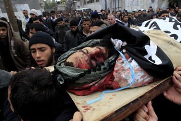 Palestinian mourners carry the body of Moamen abu Daff, known locally to be a fundamentalist Islamic Salafi militant, during his funeral in Gaza City on December 30, 2011 after he was killed earlier in the day in an Israeli air raid. AFP PHOTO