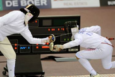 Sarra Besbes (R) of Tunisia challenges her compatriot Maya Mansouri during their women's Individual Epee final event at the 2011 Arab Games in the Qatari capital Doha on December 19, 2011. AFP
