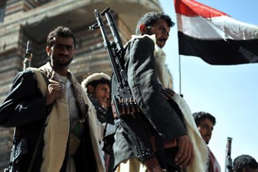 Armed tribesmen stand guard at a street leading to the residence of their tribal leader in Sana'a, Yemen, 15 January 2012. According to media sources, Yemeni tribesmen have kidnapped a Norwegian man, who was working for the United Nations, from a main street in Sana'a. The kidnappers seized the Norwegian man to press Yemeni authorities to release their fellow tribal prisoner from an intelligence prison.