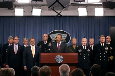 U.S. President Barack Obama (C) speaks while flanked by Secretary of Defense Leon Panetta (5thL),Chairman of the Joint Chiefs of Staff Gen. Martin Dempsey (5thR), Chief of Staff U.S. Army Gen. Raymond Odierno (6thL), Commandant of the U.S. Marine Corps Gen. James Amos (6thR), and members of the Joint Chiefs at the Pentagon on January 5, 2012 in Washington, DC. President Obama announced U.S. Department of Defense strategic priorities that will guide Pentagon spending over the next 10 years.