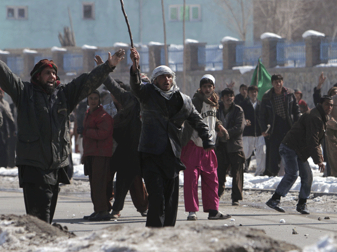 Afghan men shout anti-U.S slogans during a protest in Kabul February 23, 2012. The Taliban urged Afghans on Thursday to target foreign military bases and kill Westerners in retaliation for burnings of copies of the Koran at NATO's main base in the country as a third day of violent protests began. REUTERS/Omar Sobhani (AFGHANISTAN - Tags: CIVIL UNREST RELIGION)
