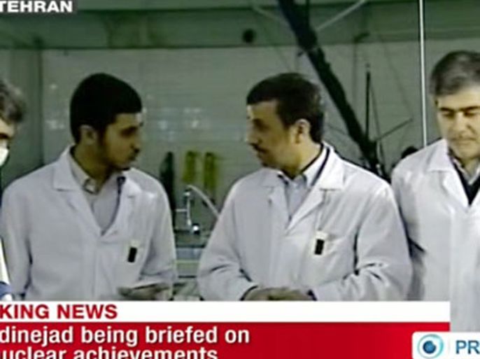 IRAN : An image grab taken from a broadcast on February 15, 2012 on the state-run Press TV shows Iranian President Mahmoud Ahmadinejad inside Tehran's research reactor. Ahmadinejad led a ceremony inserting Iran's first domestically produced, 20-percent enriched nuclear fuel into Tehran's research reactor, according to live images on state television.