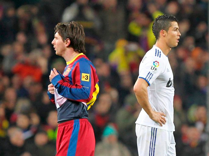 epa02688676 (FILE) A file picture dated 29 November 2010 shows FC Barcelona's Argentinian forward Lionel Messi (L) and Real Madrid's Portuguese forward Cristiano Ronaldo (R) during their Spanish Primera Division soccer match at the Camp Nou stadium in Barcelona, northeasthern Spain. Real Madrid will face FC Barcelona in the Spanish Primera Division on 16 April 2011