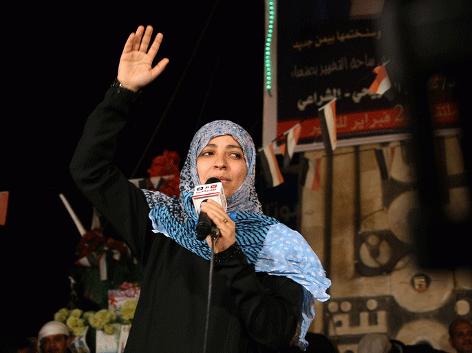 Yemen's Nobel peace laureate Tawakkul Karman addresses protesters during a celebration marking the end of the former regime in Sanaa on February 22, 2012. Yemen announced a high turnout in a landmark vote that ended Ali Abdullah Saleh's 33-year rule and named a new president, despite boycott calls in the south, where violence marred polling. AFP PHOTO/ MOHAMMED HUWAIS