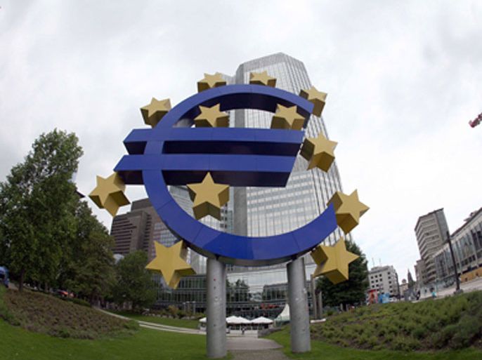 A giant symbol of the European Union's currency the Euro stands outside the headquarters of the European Central Bank (ECB) in the central German city of Frankfurt am Main on June 2, 2010الم