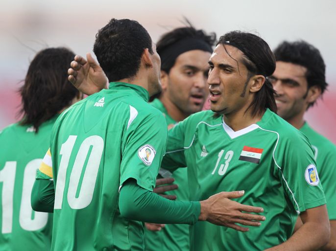 Iraq's national football team celebrate after scoring a goal against Singapore during their Group A World Cup 2014 third-round Asian qualifying match in the Qatari capital Doha on February 29, 2012. Iraq won 7-1. AFP PHOTO/KARIM JAAFAR