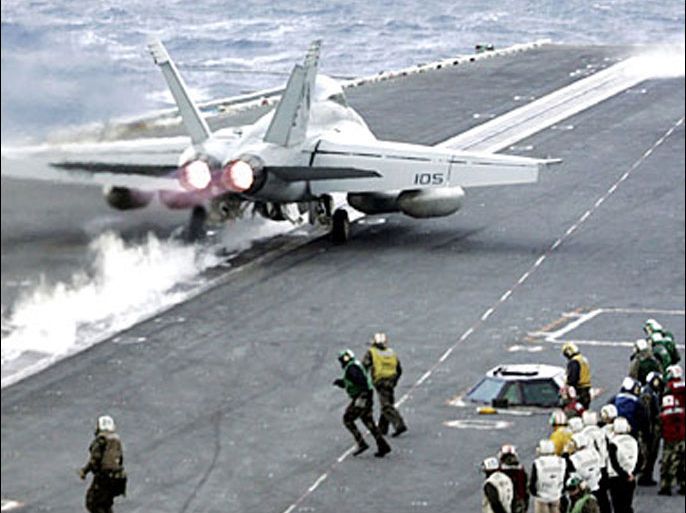 A F-18 Super Hornet is launched from the deck of the US Navy carrier USS Abraham Lincoln during the Foal Eagle exercises off Ulsan, South Korea, 30 March 2006. About 25,000 US troops and an undisclosed number of South Korean soldiers are participating in the maneuvers, dubbed RSOI and Foal Eagle, which began 25 March and was to wrap up on 31 March. AFP PHOTO/Lee Jin-man/POOL