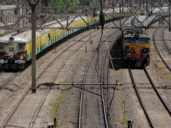 Passenger trains are seen approaching Sion railway station in Mumbai on March 13, 2012 ahead of the announcement of the railways budget in the Indian parliament.