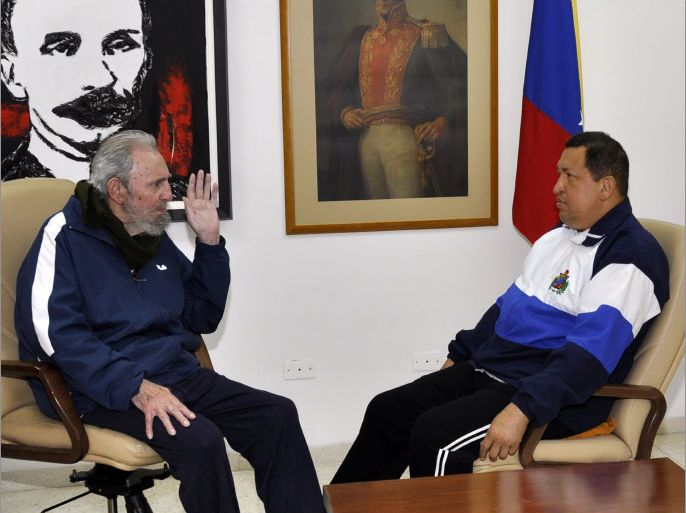 Handout picture taken by Cuban Estudio Revolucion and released by the Venezuelan Minister of Communications and Information, Andres Izarra, via his Twitter account, showing Venezuelan President Hugo Chavez (R) and former Cuban president Fidel Castro having a conversation at the Centre for Medical-Surgical Research in Havana on March 2, 2012. Chavez said Thursday he was recovering "rapidly" from surgery to remove a potentially cancerous lesion. "I am well and I am recovering rapidly," he said in a telephone call to the state-run VTV television, his first public comment since undergoing the operation in Cuba on Monday. Chavez, who is running for a third term as president, underwent surgery this week in Havana for what he called an "injury" in the same area around the pelvis where a tumor was extracted in June 2011. AFP PHOTO/ESTUDIO REVOLUCION --- RESTRICTED TO EDITORIAL USE - MANDATORY CREDIT "AFP PHOTO/ESTUDIO REVOLUCION" - NO MARKETING NO ADVERTISING CAMPAIGNS - DISTRIBUTED AS A SERVICE TO CLIENTS - NO ARCHIVES