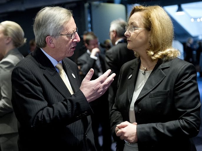 Eurogroup Chairman and Luxembourg Prime Minister Jean-Claude Juncker (L) speaks with Austrian Finance Minister Maria Fekter (R) at the start of the European Union Economic and Financial Affairs Council (ECOFIN) meeting in Copenhagen on March 30, 2012. AFP