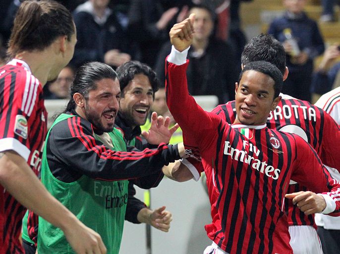 AC Milan's Urby Emanuelson (R) celebrates with his teammates after scoring against Parma during their Italian Serie A soccer match at the Tardini Stadium in Parma March 17, 2012.