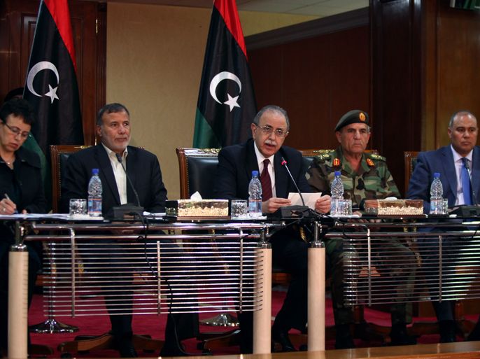 Libyan Prime Minister Abdel Rahim al-Kib (C) speaks during a press conference with ministers of the Libyan Transitional Government including minister of health Fatma aL-Hamrush (L) , minister of defence Osama Juili (2L) , Libya's army chief Yussef al-Mangush (2R) and Libyan government spokesman Salah al-Manaa (R) during a press conference on the latest developments in the south of Libya, in Tripoli on March 31, 2012. Libya's interim government on March, 31 announced a ceasefire aimed at ending six days of deadly tribal clashes in a southern desert oasis that cost more than 150 lives. AFP