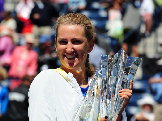 Victoria Azarenka of Belarus poses with the winner's trophy after defeating Maria Sharapova of Russia the final of the BNP Paribas Open at the Indian Wells Tennis Garden on March 18, 2012 in Indian Wells, California. Azarenka won 6-2, 6-3.