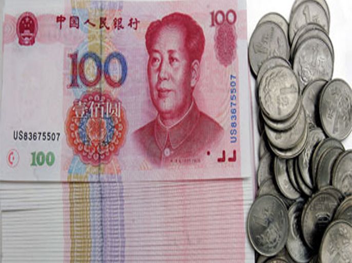 afp: (files) this 14 january 2007 file photo, show a stack of chinese 100 yuan notes and one yuan coins in beijing. china is not intentionally manipulating its currency to gain an unfair (الفرنسية)