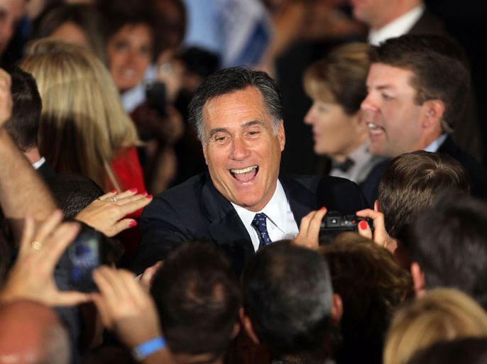 Republican presidential candidate, former Massachusetts Gov. Mitt Romney greet supporters during an Illinois GOP primary victory party at the Renaissance Schaumburg Convention Center Hotel March 20, 2012 in Schaumburg, Illinois. Exit polls showed Romney leading his closest rival