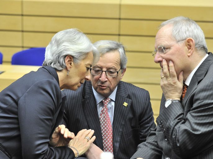 International Monetary Fund Managing Director Christine Lagarde, Luxembourg Prime Minister and Eurogroup president Jean-Claude Juncker and German Finance Minister Wolfgang Schauble, speak before for a meeting of Eurozone finance ministers to decide if Greece has met initial requirements to qualify for the release of another tranche of aid,