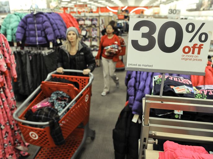 epa03042102 Customers shop for bargains at a Target store in Glenview, Illinois, USA, 23 December 2011 after US Commerce Department data reported that personal wages and salaries dropped 0.1 percent from October figures and personal spending climbed 0.1 percent, less than the expected 0.2 percent to 0.6 percent range. Target is attempting to counter the slow economic growth by offering holiday promotions and incentives to draw customers into their stores.