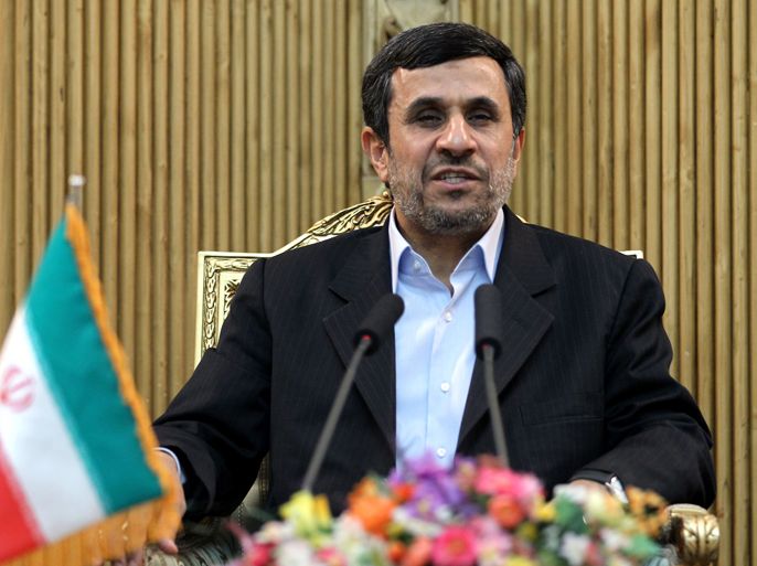 Iranian President Mahmoud Ahmadinejad speaks to the press prior to leaving Iran for Tajikistan at Tehran's Mehrabad airport on March 24, 2012. Ahmadinejad and his Afghan and Pakistani counterparts will meet in Tajikistan to mark Noruz (Persian new year) and to discuss Afghan economy.
