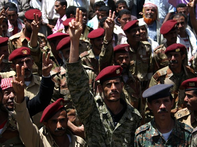 Members of the Yemeni army flash the sign for victory during a sit-in demanding for the dismissal of former leader Ali Abdullah Saleh's relatives that remain in powerful military posts, in Sanaa on April 16, 2012 . AFP