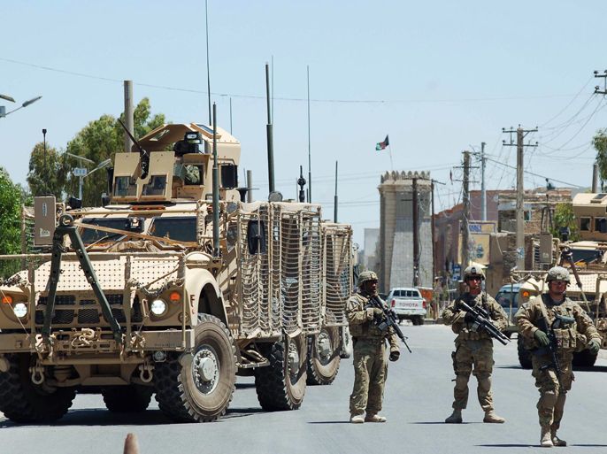 US Soldiers stop traffic leading to the governor's compound in Kandahar on April 28, 2012. Two bodyguards and two suicide attackers were killed in a firefight inside the governor's compound in Afghanistan's southern Kandahar province Saturday, an official said. AFP