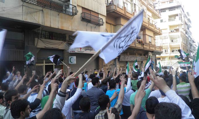 Demonstrators protest against Syria's President Bashar al-Assad after Friday prayers in Homs April 27, 2012. Picture taken April 27.