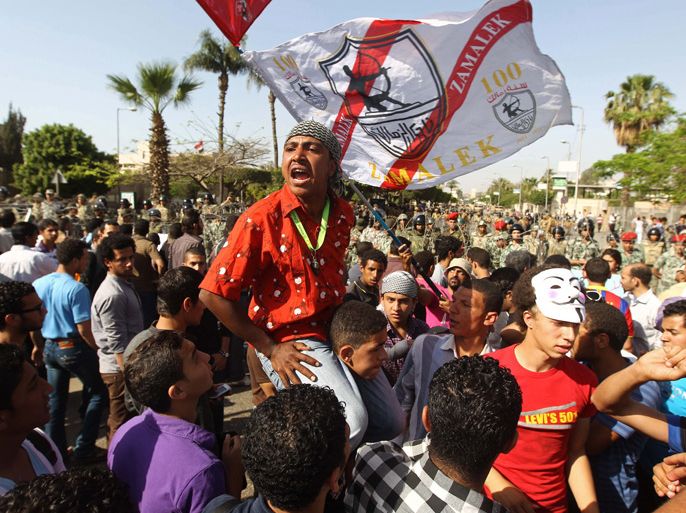 EGYPT : Egyptian protesters shout slogans during a demonstartion against the interim military leadership outside the defence ministry in the Abbassiya district of Cairo on April 29, 2012. The first round of post-revolution presidential election is scheduled for May 23 and 24, and the interim military leadership has promised to hand power to an elected