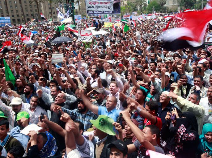 People chant during a protest in Tahrir Square in Cairo April 13, 2012. Thousands of Egyptians packed into Cairo's Tahrir Square on Friday to protest against a run for the presidency by former intelligence chief Omar Suleiman, in an Islamist show of strength against Hosni Mubarak's old guard