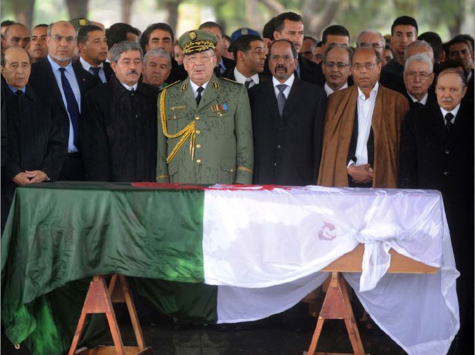 (From R) Algerian President Abdelaziz Bouteflika, Tunisian President Moncef Marzouki, and Polisario front President Mohamed Abdelaziz and other officials stand behind the wooden coffin of Algeria's first post-independence president Ahmed Ben Bella during his State funerals on April 13, 2012 in Algiers. Ben Bella, hailed as an anti-colonial hero and the father of the nation, and died two days before at age 95 following a recent hospital stay for respiratory problems, was laid to rest in the Martyrs' plot in Algiers' El Alia cemetery, alongside other independence fighters. AFP PHOTO / FAROUK BATICHE
