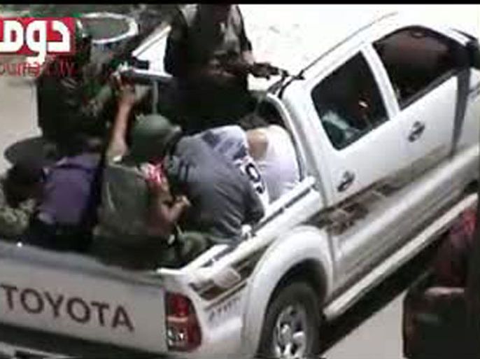 An image grab taken from a video uploaded on YouTube on April 26, 2012 allegedly shows arrested men in the back of a pick-up truck on April 25, 2012, in the Syrian town of Duma. Syrian troops pressed a campaign to crush anti-regime opponents, activists said as France held out the threat of military action to halt the bloodshed that has persisted despite a ceasefire
