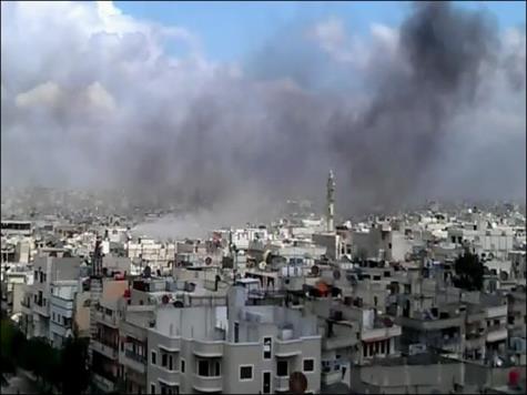 ‪قصف سابق لقوات النظام بالهاون على حيي الخالدية والحميدية في حمص‬ (الجزيرة)