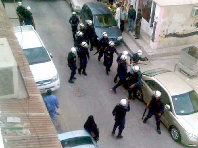 A handout picture released by al-Wefa Media Centre shows Bahraini riot police arresting a Shiite protestors in the street in the capital, Manama, during a pro-democracy demonstration on April 19, 2012. As Bahrain prepares to host the Grand Prix Formula One race on April 22, demands by protesters for democratic change are intensifying and the government position is hardening,