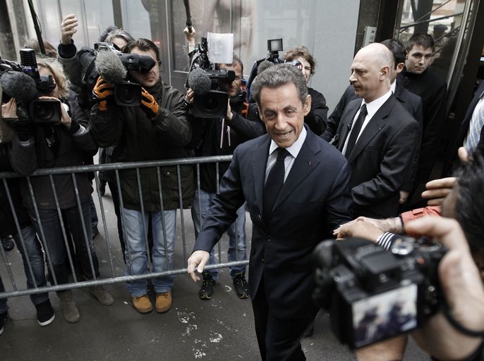 France's incumbent president and Union for a Popular Movement (UMP) candidate Nicolas Sarkozy (C) leaves his party's campaign headquarters in Paris after a political committee on April 23, 2012. Socialist challenger Francois Hollande won the first round of the French presidential vote on April 22, 2012, setting himself up for a May 6 run-off with right-wing incumbent Nicolas Sarkozy. AFP