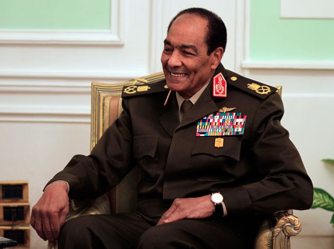 epa03100839 head of Egypt's ruling military council Field Marshal Mohamed Hussein Tantawi smiles during his meeting with US Chairman of the Joint Chiefs of Staff, General Martin Dempsey (not pictured), at the Ministry of Defense in Cairo, Egypt, 11 February 2012. According to local media reports, Dempsey arrived in Egypt on a one week visit to hold security talks with the countryâ×?s military rulers. The visits comes amid tensions over the criminal charges brought against 19 American NGO workers. Egypt had issued travel bans on six of the American NGO workers, including a son of US Transportation Secretary Ray LaHood. EPA/KHALIL HAMRA/POOL