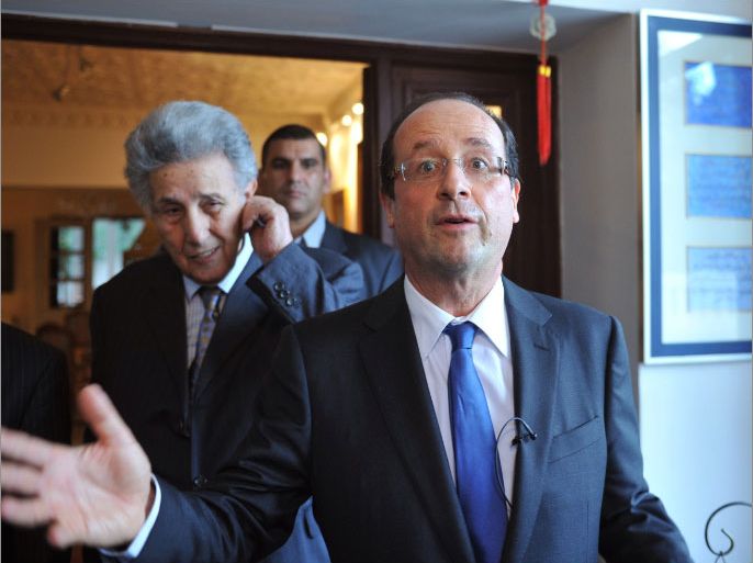 Caption:French deputy and former head of the French Socialist party Francois Hollande (R) and former Algerian President Ahmed Ben Bella (1962-1965) are pictured prior to their meeting on December 8, 2010 in Algiers. Hollande pays a three-day visit to Algeria.