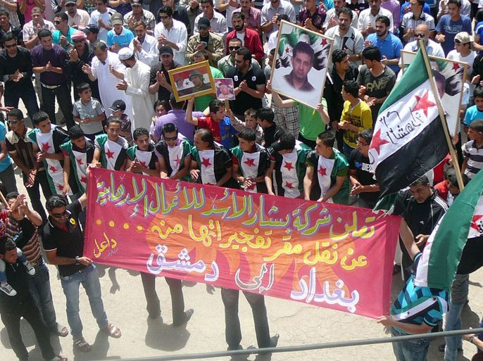 An image released by the Syrian opposition's Shaam News Network, shows an anti-regime demonstration in the town of Dael in Daraa province on May 11, 2012. Tens of thousands of protesters defied regime gunfire and took to the streets, a day after twin bombings killed dozens of people in Damascus, a monitoring